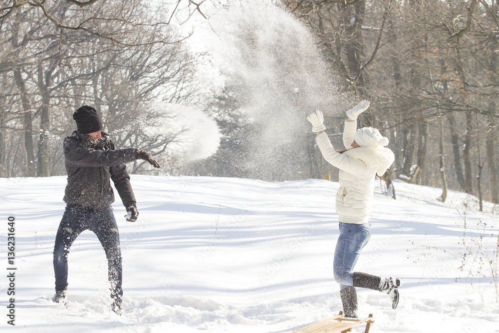 Young couple enjouing at snow 