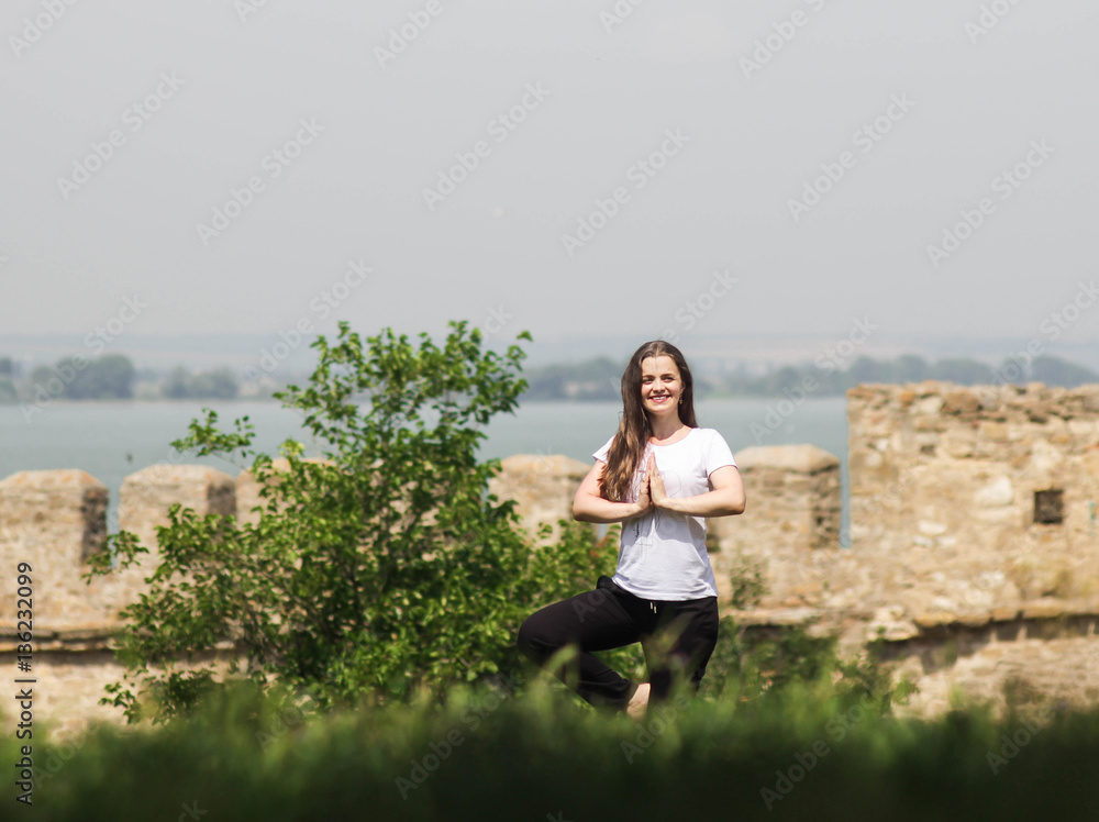 Woman doing yoga outdoors