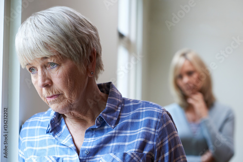Konstfotografi Serious Senior Woman With Adult Daughter At Home