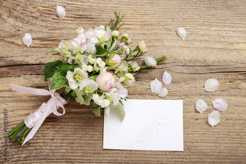 Romantic bouquet with flowering twigs of apple tree, lilly of th