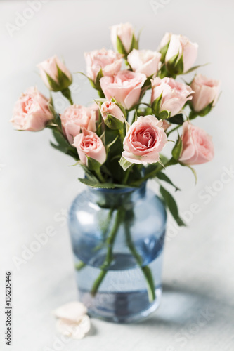 Pink spray roses in blue vase