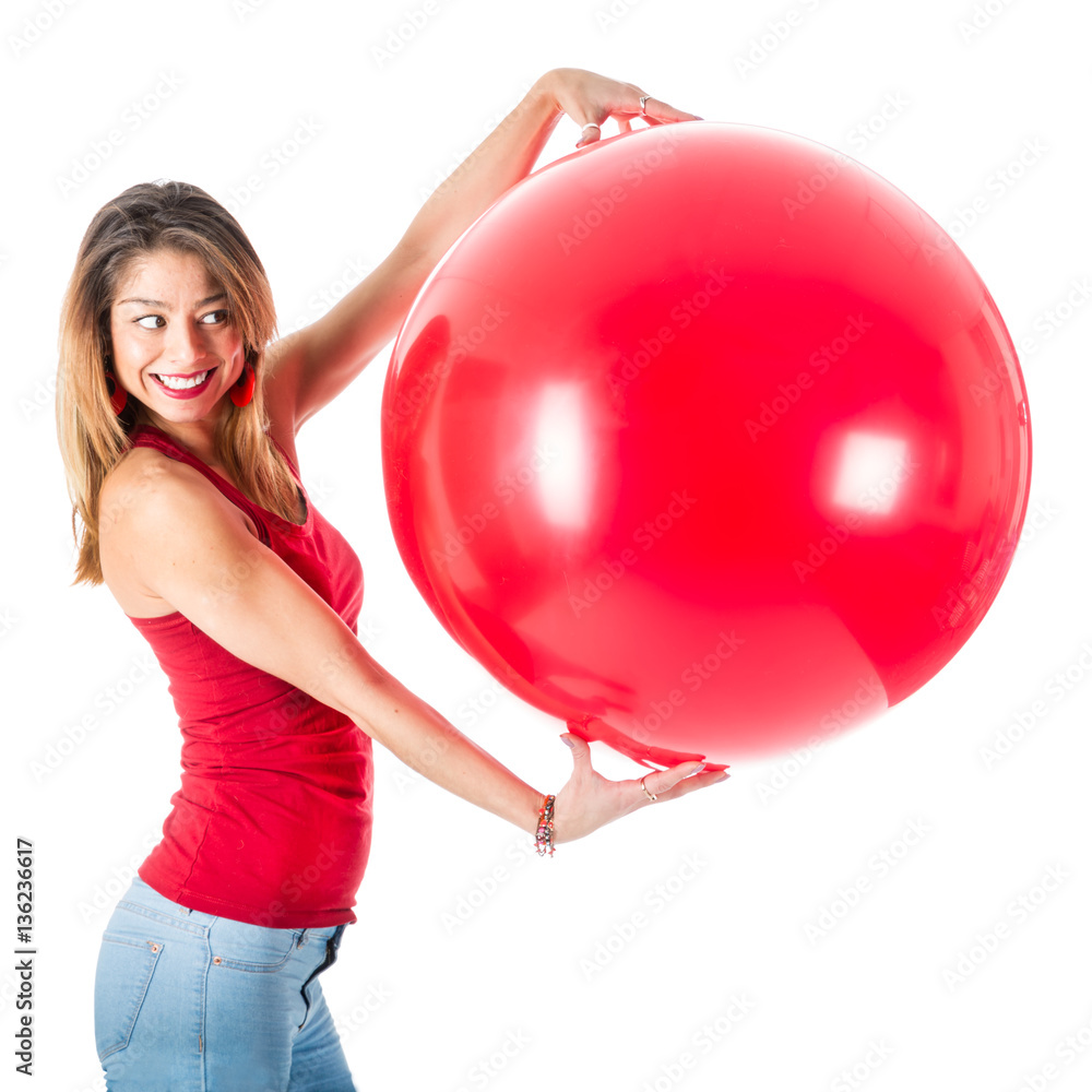 Beautiful woman with red shirt holding a mega balloon Beautiful woman with red shirt holding a mega balloon