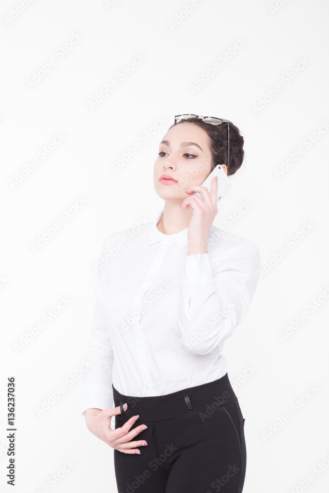 Business woman talking on a mobile phone Business woman talking on a mobile phone