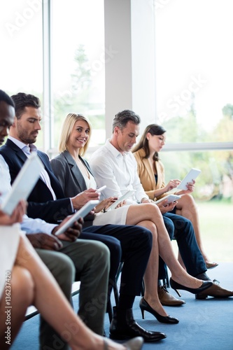 Business executives using digital tablet