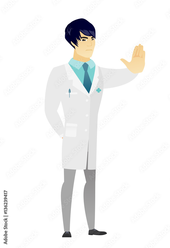 Asian doctor showing stop hand gesture. Asian doctor showing stop hand gesture.