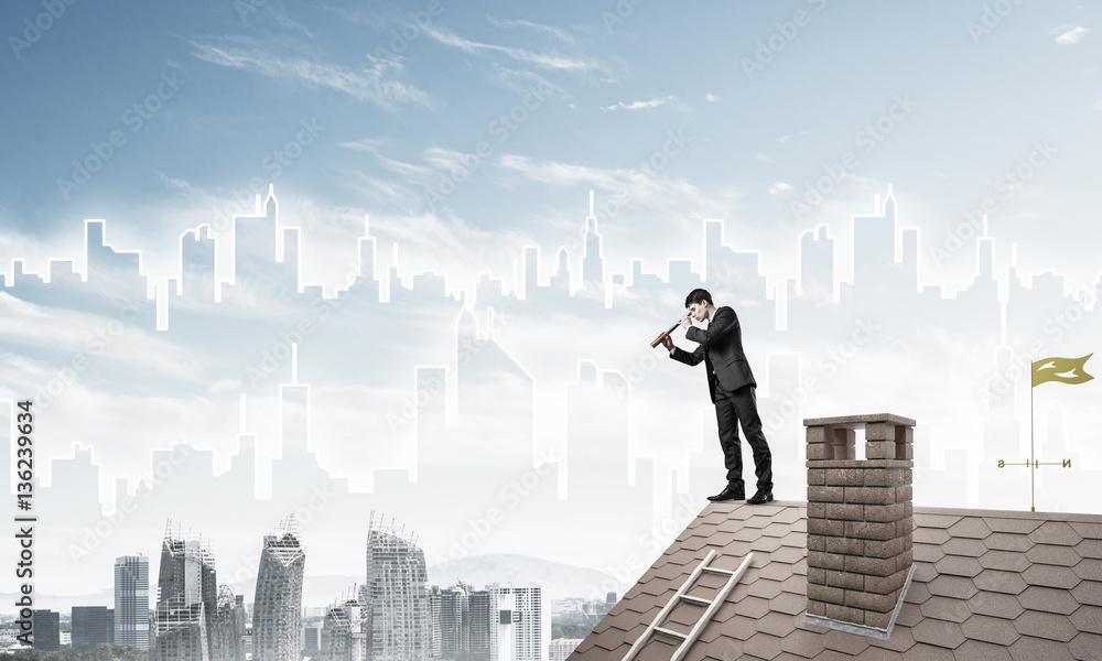 Engineer man standing on roof and looking in spyglass. Mixed med Engineer man standing on roof and looking in spyglass. Mixed med