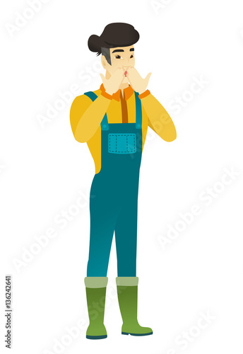 Shoked asian farmer covering his mouth.