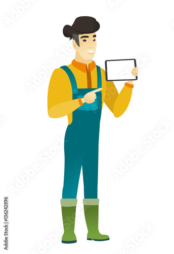 Smiling farmer holding tablet computer.