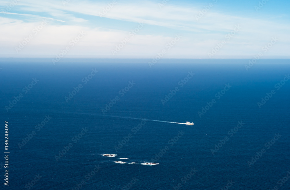 Small ship passing a reef at West Cape, Stad, Norway Small ship passing a reef at West Cape, Stad, Norway