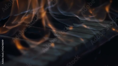The fire is burning keys of a piano