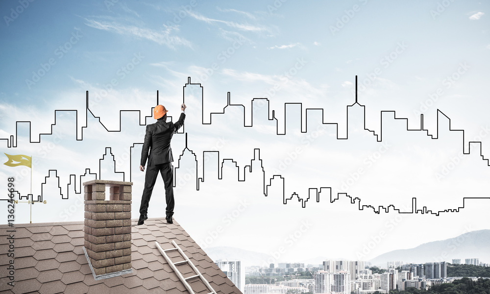Man architect draw silhouette of modern city on blue sky. Mixed Man architect draw silhouette of modern city on blue sky. Mixed