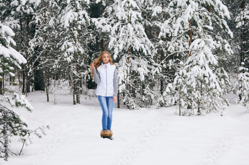 Girl in the winter forest.