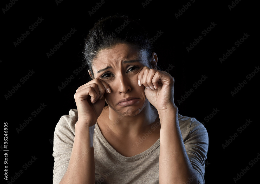 attractive sad and desperate Latin woman crying frustrated suffering problems in sadness and stress attractive sad and desperate Latin woman crying frustrated suffering problems in sadness and stress