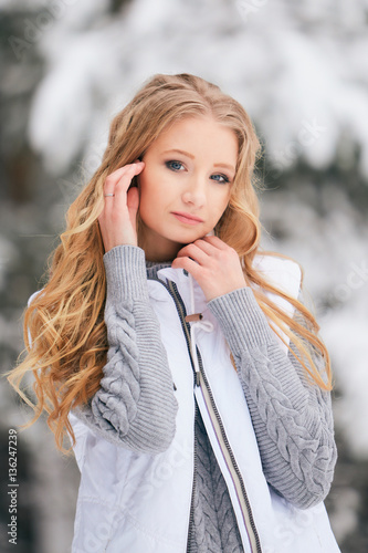 Girl in the winter forest.