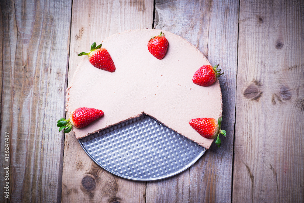 Chocolate cheese cake with strawberries on a tray Chocolate cheese cake with strawberries on a tray