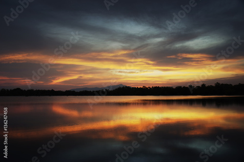 A calm evening landscape with lake and mountains, time to rest, peace of nature concept