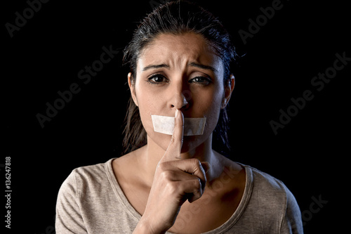 Photography close up portrait of young attractive woman with mouth and lips sealed in adhesi