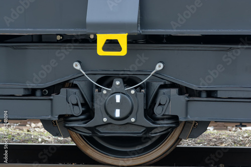 Bumper and coupler - hang rail car .Freight (cargo) train - black cars (wagons). New 6-axled flat wagon ,Type: Sahmmn, Model WW 604 A, Transvagon AD photo