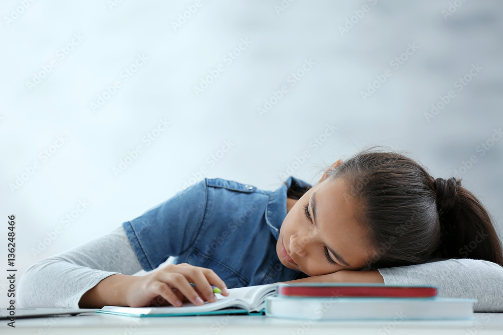 Cute girl tired of doing lessons at home Cute girl tired of doing lessons at home