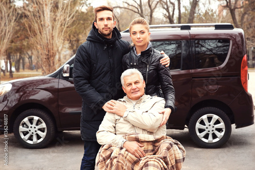 Young couple with man in a ...