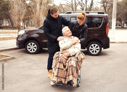 Young couple with man in a ...