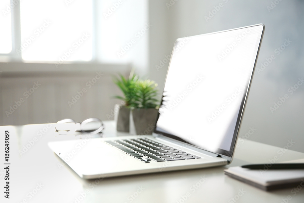 Workplace with modern laptop on table Workplace with modern laptop on table
