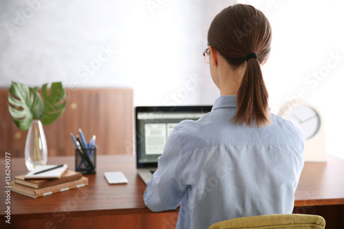 Woman working on computer a...