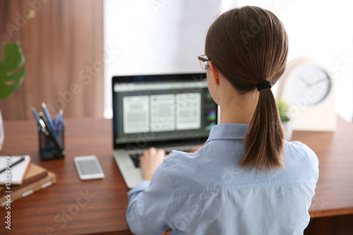Woman working on computer a...