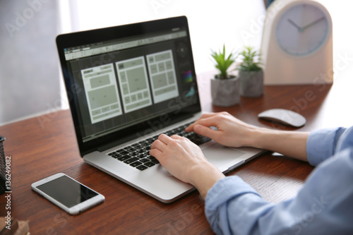 Woman working on computer a...