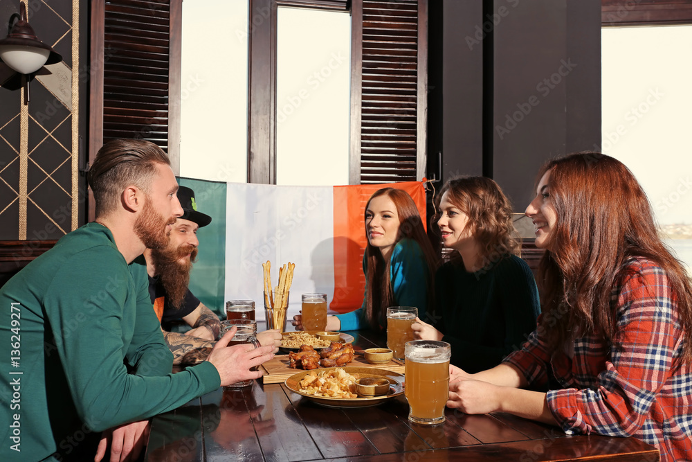 People celebrating Saint Patrick's Day in pub People celebrating Saint Patrick's Day in pub