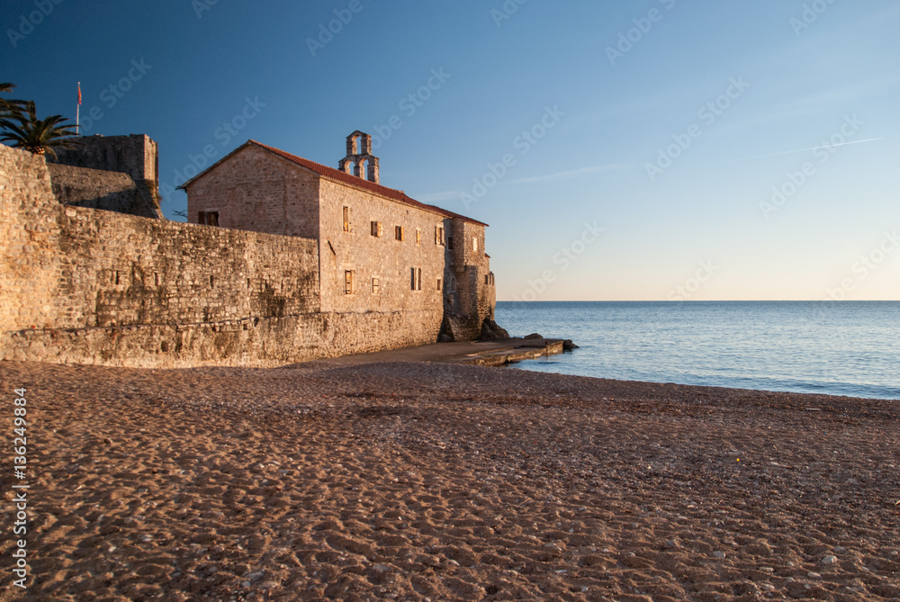 Ancient stone buildings by the sea at sunset in old town Budva, Montenegro Ancient stone buildings by the sea at sunset in old town Budva, Montenegro
