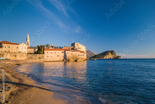Ancient stone buildings by the sea at sunset in old town Budva  Montenegro