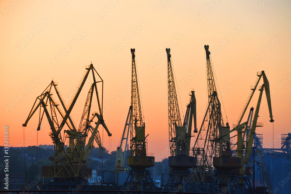 Port cargo crane at sunset