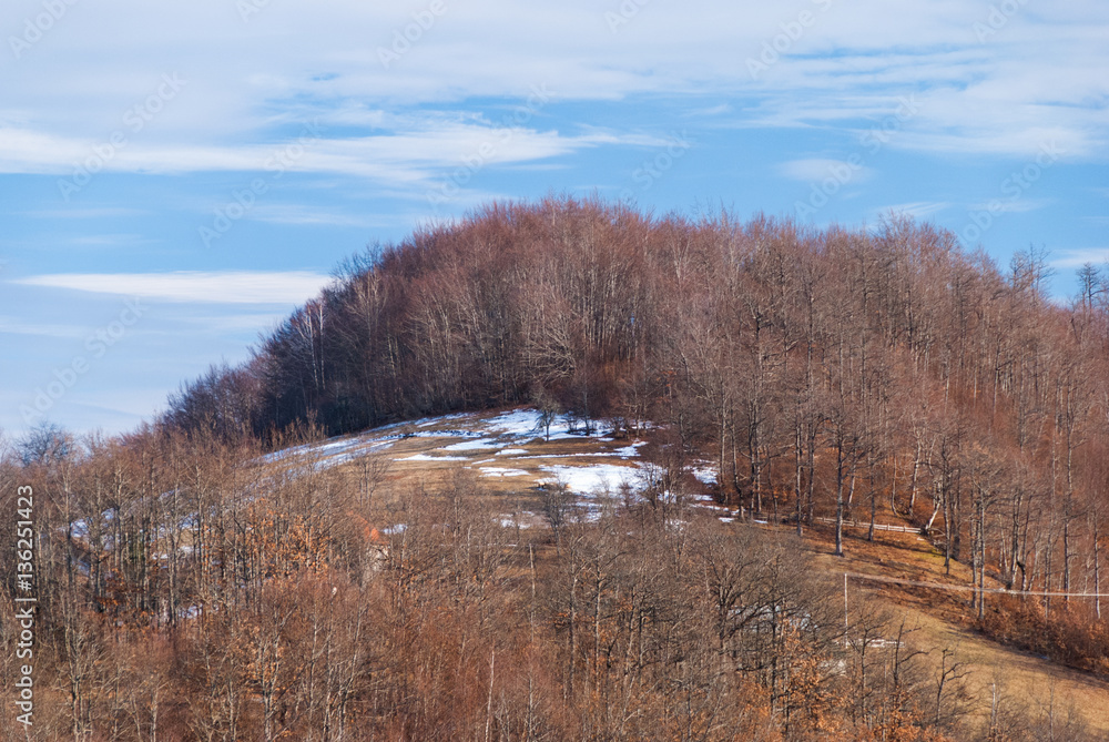 Mountain peak covered in melting snow during the spring Mountain peak covered in melting snow during the spring