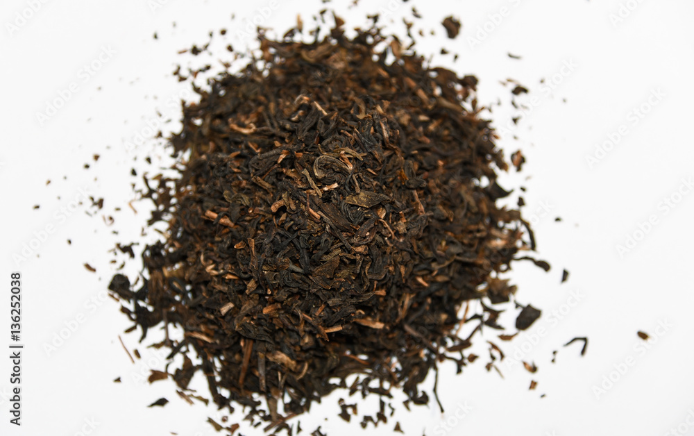 dried loose oriental asian black tea leaves for tea infusion on white background close up dried loose oriental asian black tea leaves for tea infusion on white background close up