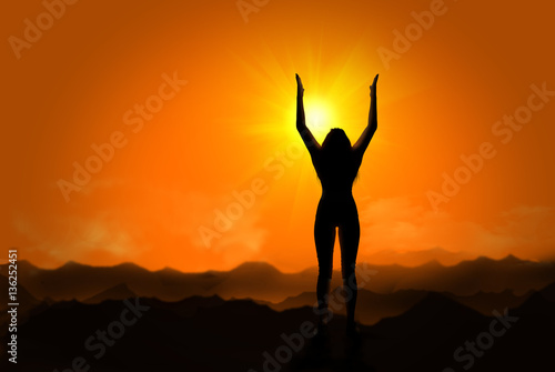 Silhouette of woman doing yoga at sunset © Giovanni Cancemi