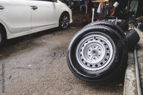 Car tires standing at car repair shop.