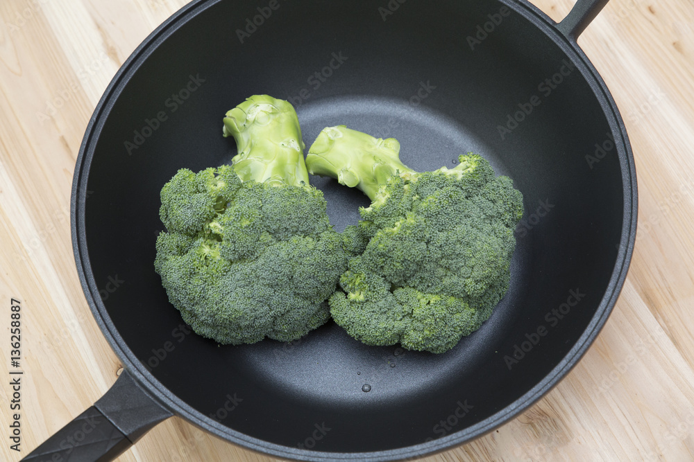 Fresh broccoli on wood table Fresh broccoli on wood table