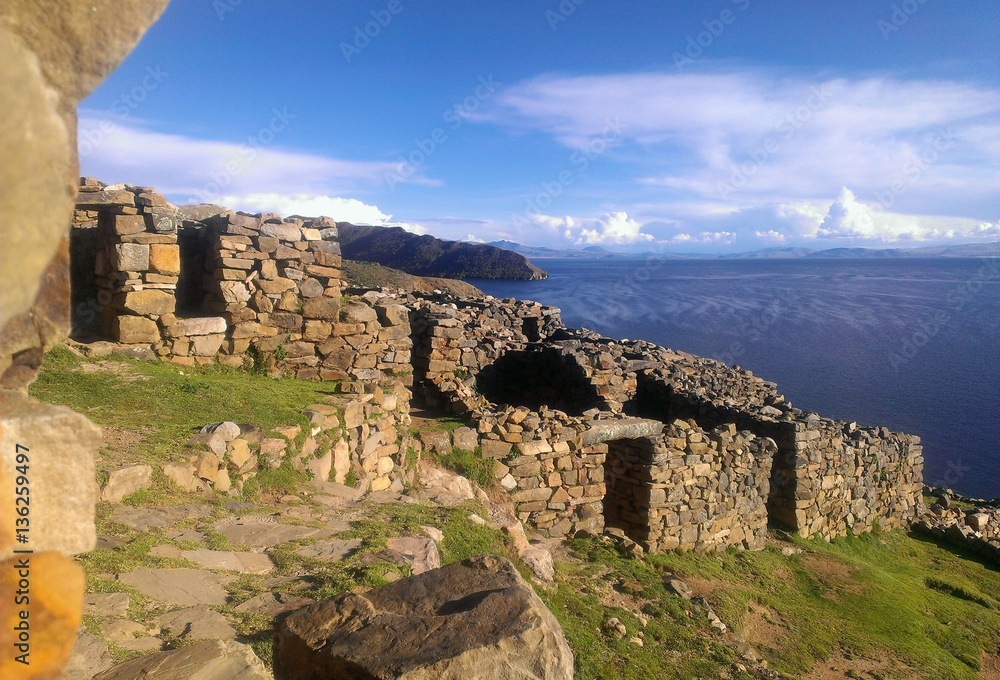 Ruins on a cliff top overlooking the highest navigable fresh water lake in the world, Lake Titicaca