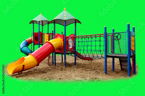 Colorful playground for children isolated on green background.