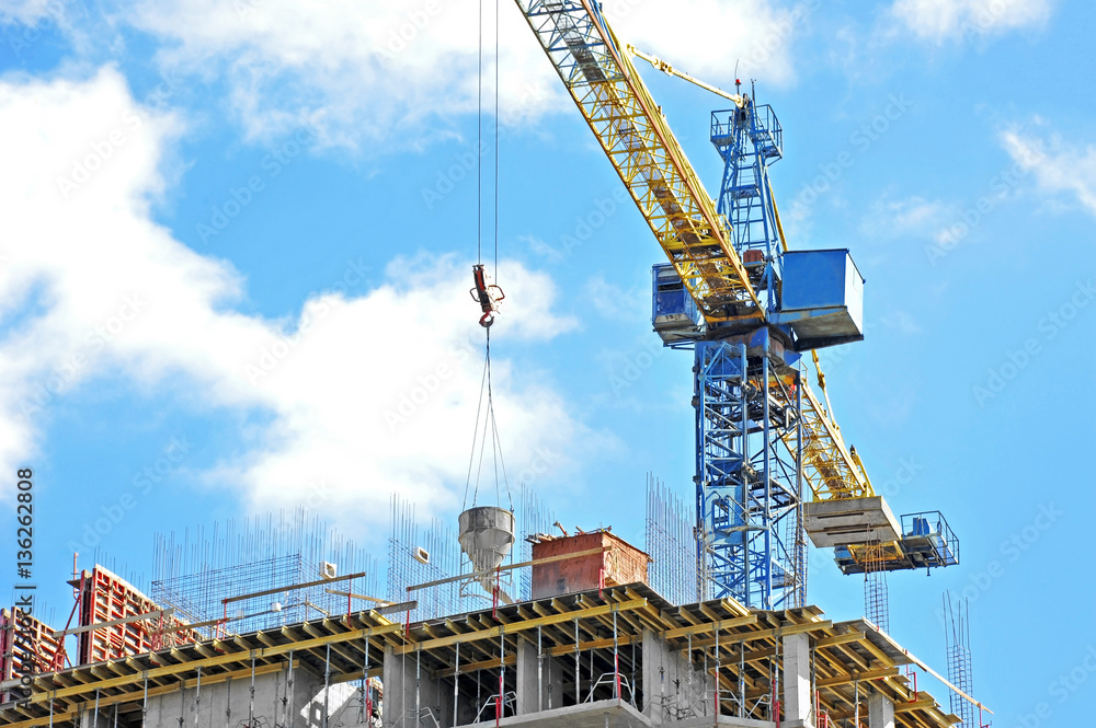 Crane lifting cement mixing container