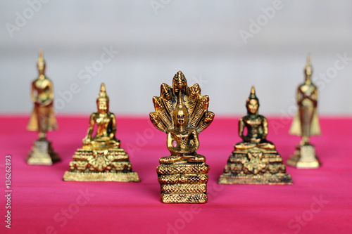 Buddha on a wooden pink