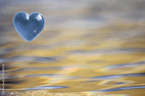 Blue Heart with soft focus water reflections