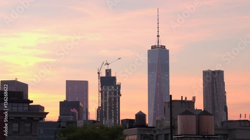 CLOSE UP: Driving past One World Trade Center and residential buildings at dawn