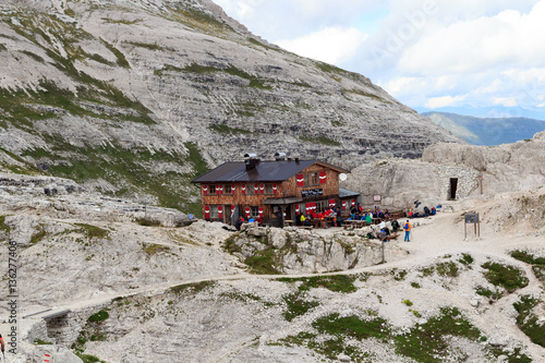 People at alpine Hut Büllelejochhütte in Sexten Dolomites, South Tyrol, Italy photo