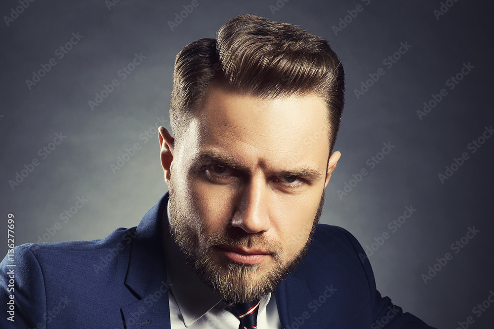 Man with fresh stile hair cut over dark background Man with fresh stile hair cut over dark background