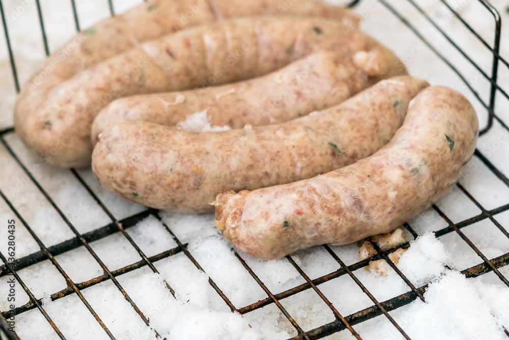 Sausages on the grill in the snow