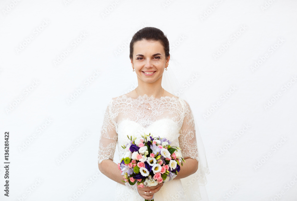 cute bride admires her bouquet of colored flowers cute bride admires her bouquet of colored flowers