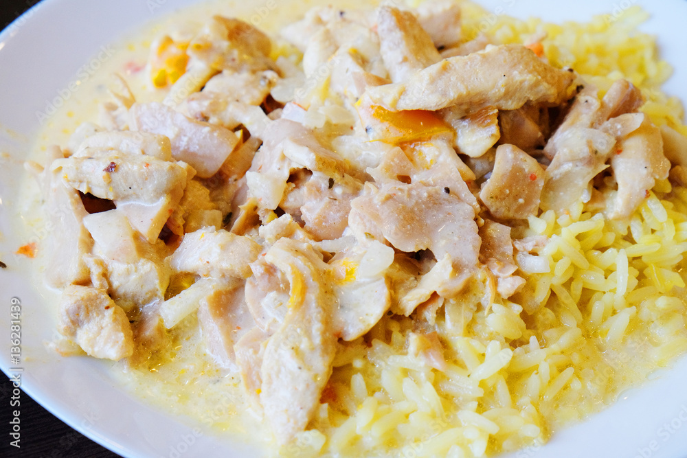 rice with chicken and mushrooms in cream sauce closeup rice with chicken and mushrooms in cream sauce closeup