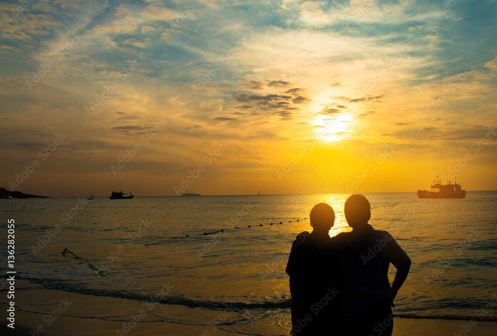 Couple in love see sunshine on the beach